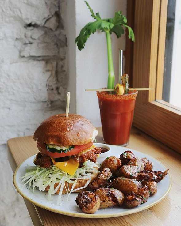 Burger with fries at Little Fern